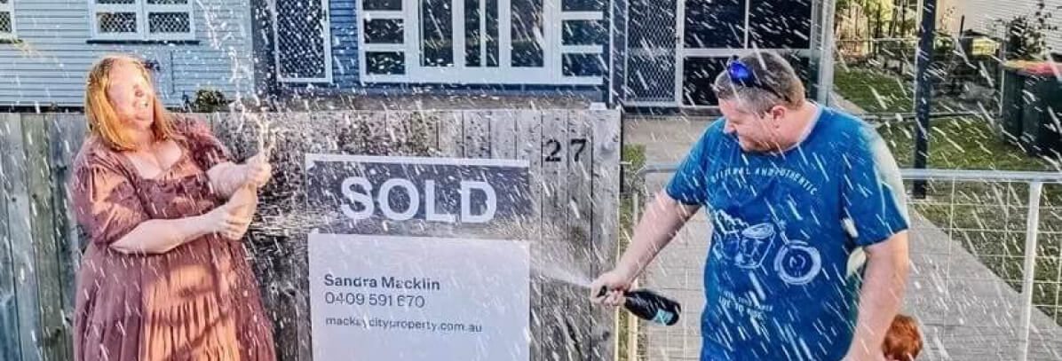 Couple Celebrating to their sold property - Sold by Sandra Maclin at Mackay City Property Real Estate Agency Mackay